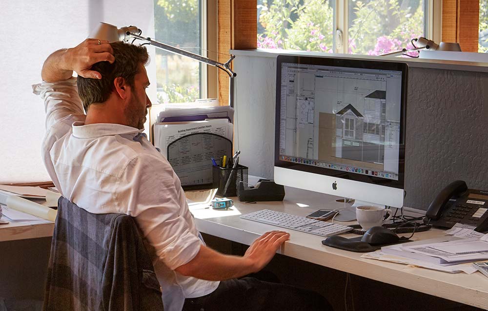 Jamie Amdurer at Desk with Computer Monitor