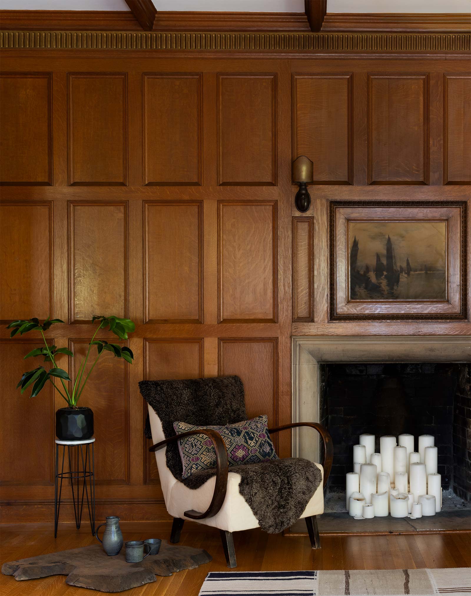 Armchair and Fireplace Filled with Candles, interior