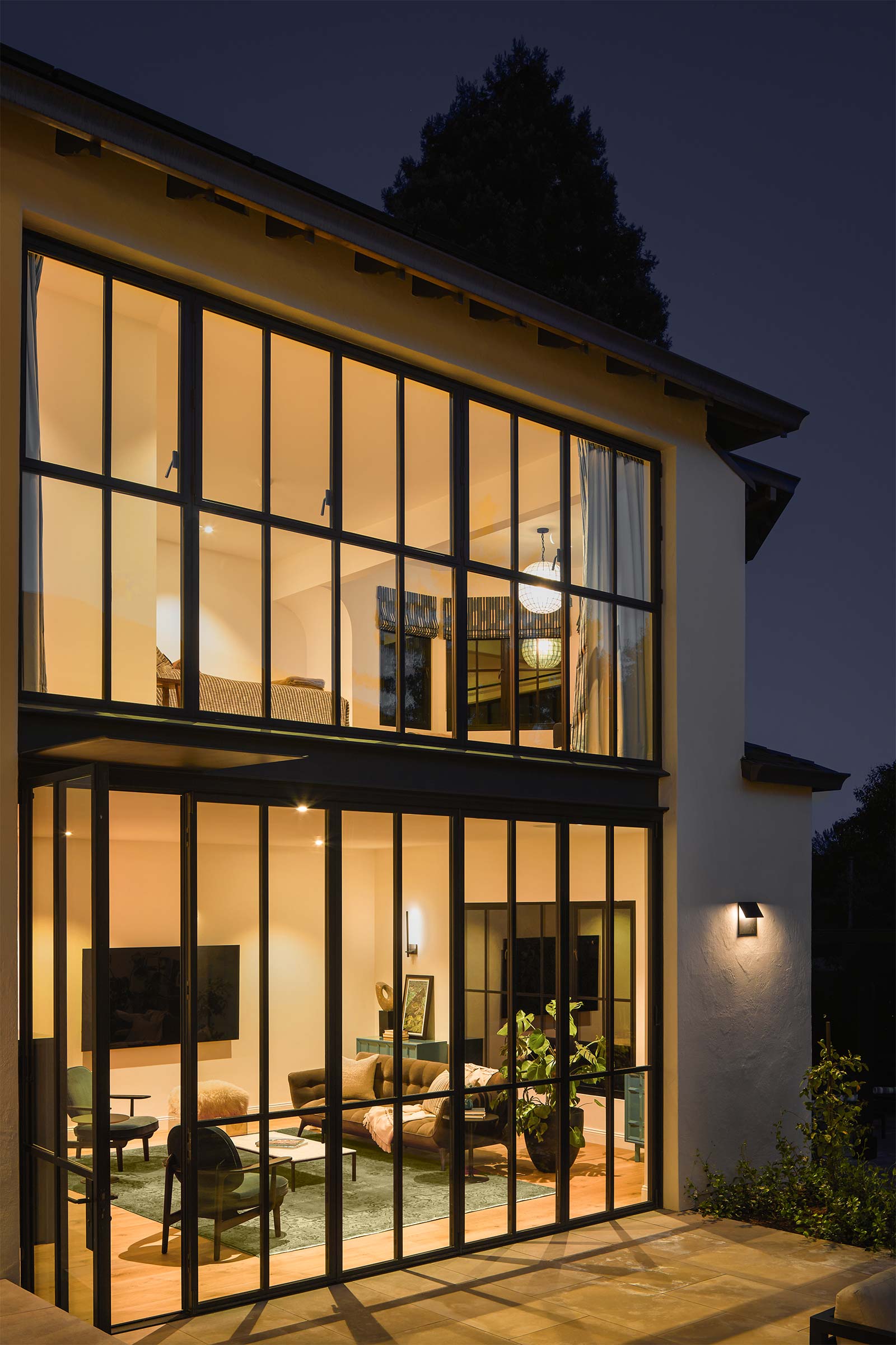 Living Area from Courtyard at Dusk, exterior to interior